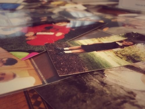 Scattered photos of child growing up.