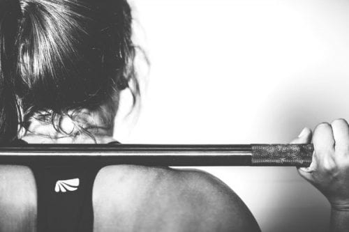 A woman lifting weights.