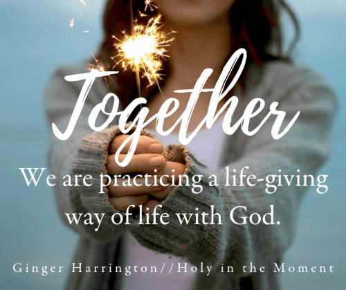 Woman holds sparkler as an illustration of the life of Christ that binds Christians together