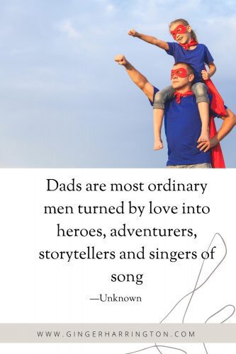 Dad and child in super hero costume