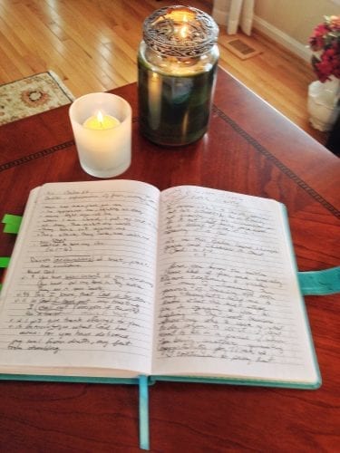 On open journal on a desk shows an example of a way to meditate on God's Word through writing and journaling.