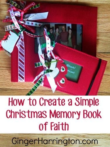 Red scrapbooks decorated with Christmas ribbon 