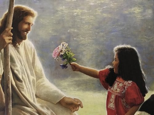 A little girl in a read dress offers Jesus flowers in a post on how Jesus blessed the children, teaching the importance of child-like faith.