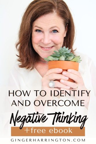 Woman smiles and holds a plant to illustrate post on overcoming negative thinking patterns