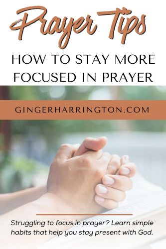 Hands folded in prayer with open Bible illustrate article on tips for focused prayer.