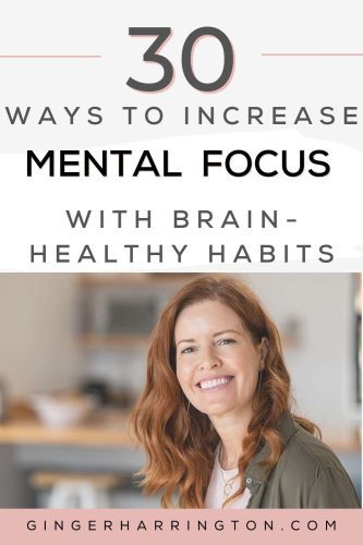 Red-headed woman smiles at camera to illustrate a post on mental focus.