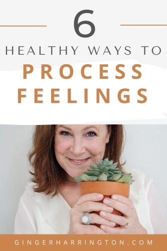 Author Ginger Harrington holds a potted plant to demonstrate learning to process feelings for greater emotional health.