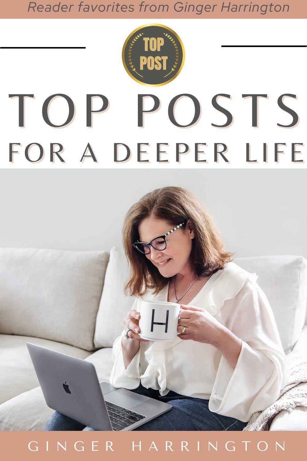 Author Ginger Harrington working on laptop and holding a coffee mug.