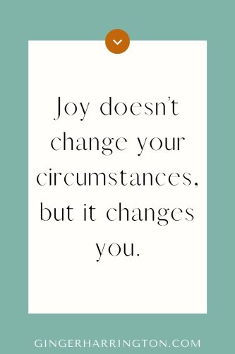 Christian quote graphic on green background with text: “Joy doesn’t change your circumstances, but it changes you.” Inspirational faith-based encouragement by Ginger Harrington.